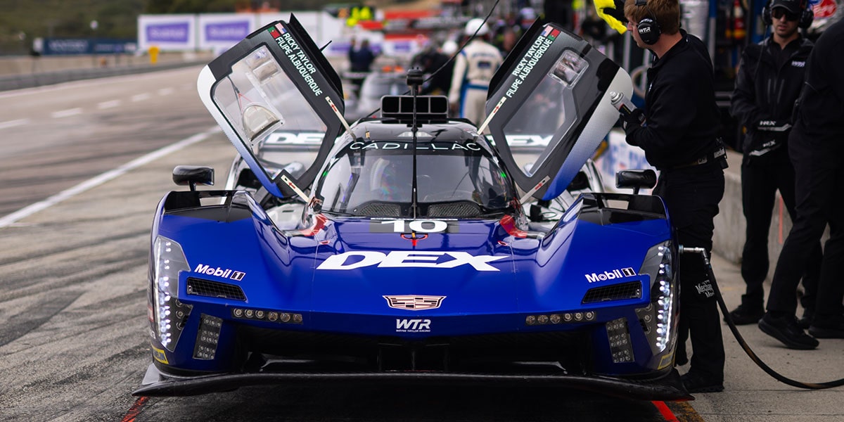 Front View of the Red No. 31 Whelen Engineering Cadillac V-Series.R Racecar with its Butterfly Doors Open
