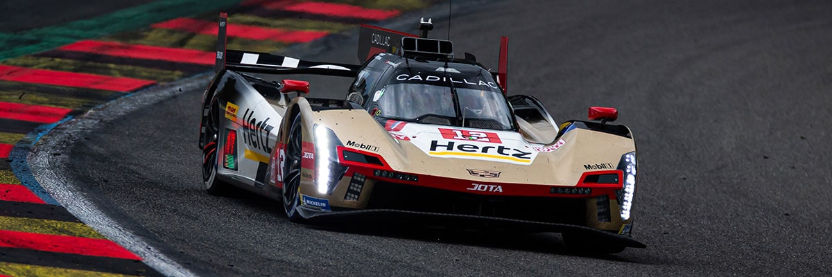 Three-quarter View of the No.38 Cadillac V-Series.R Racecar Driving on a Race Track