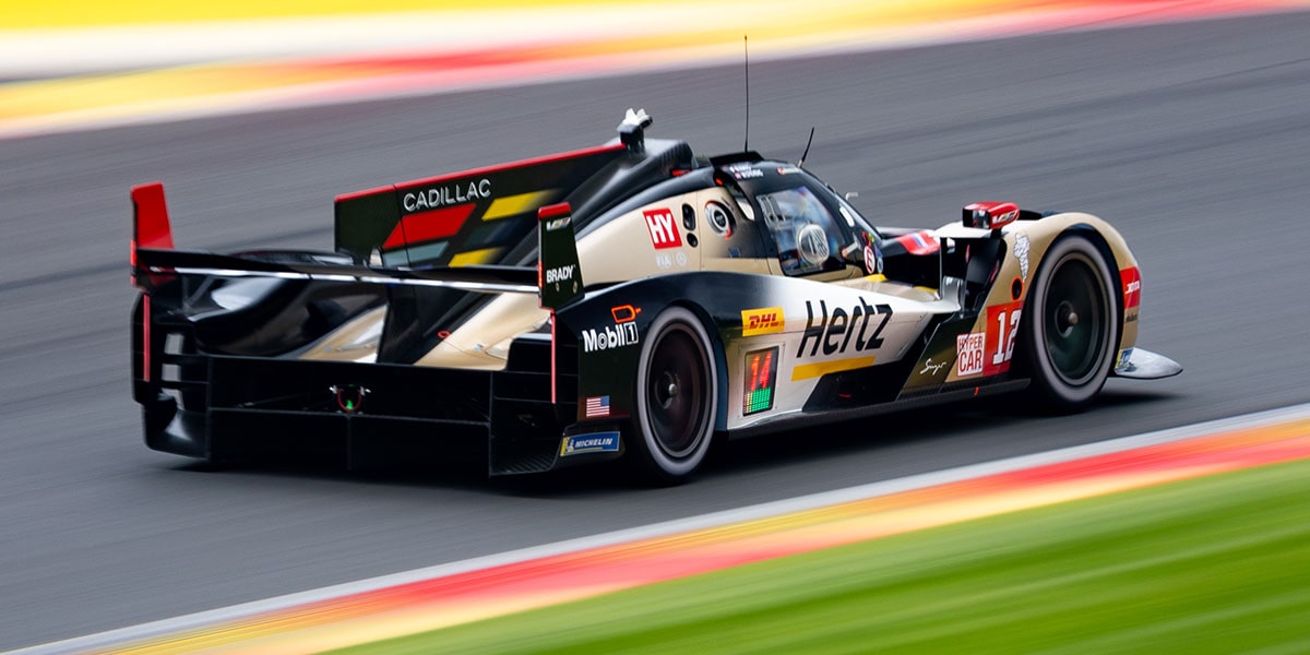 Rear Three-quarter View of the No.12 Cadillac V-Series.R Racecar Speeding on a Race Track