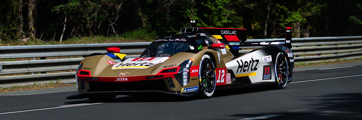 Three-quarter View of the No.38 Cadillac V-Series.R Racecar Driving on a Race Track