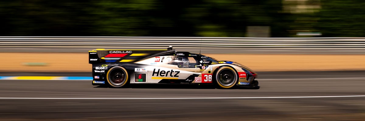 Profile View of the No.12 Cadillac V-Series.R Racecar Speeding on a Race Track