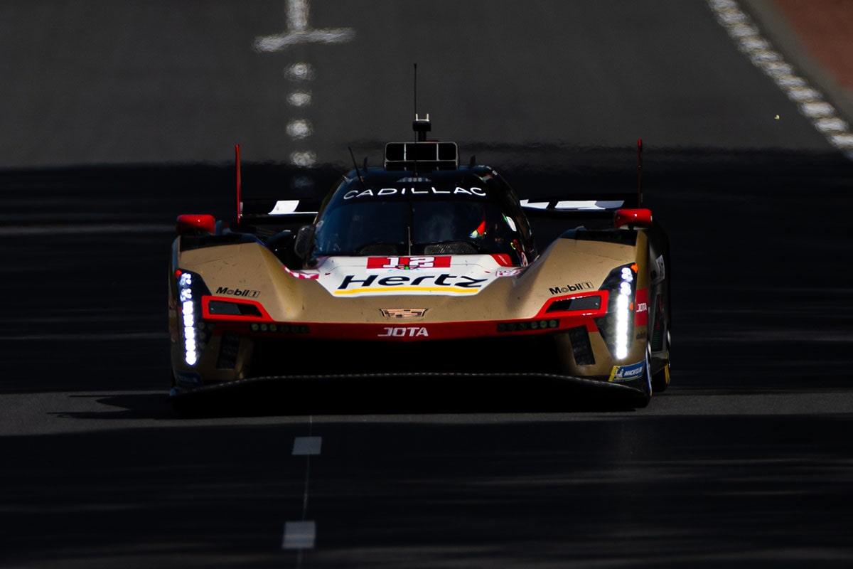 Front View of the No.38 Cadillac V-Series.R Racecar Driving on a Race Track