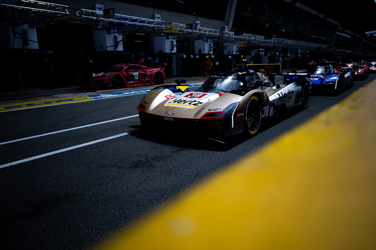 The No.101 Cadillac V-Series.R Racecar Speeding Down the Track Followed by Competitors