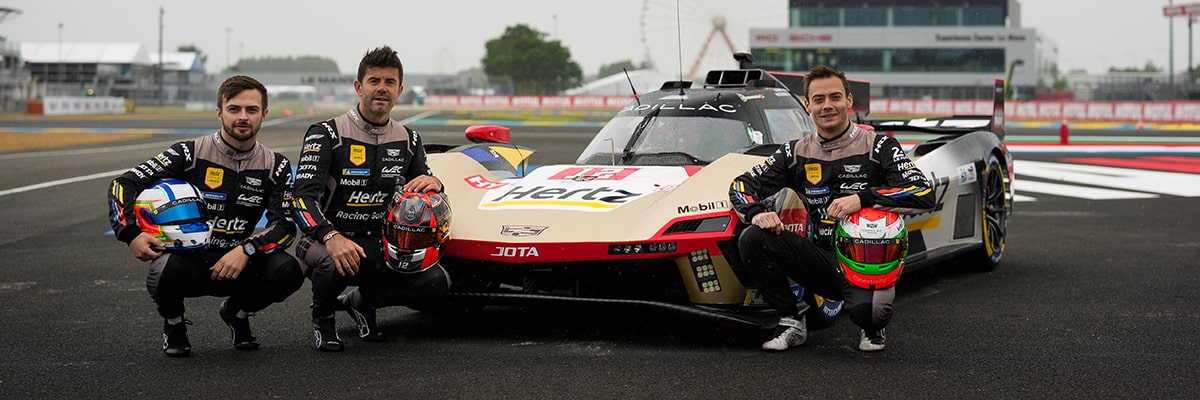 Profile View of a Cadillac Race Car Speeding By on a Racetrack