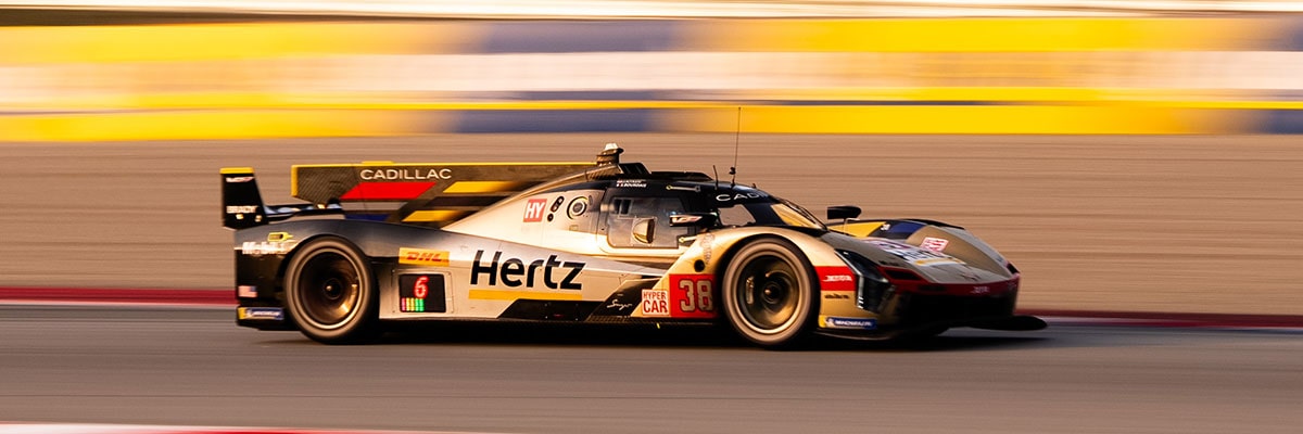 Side Profile of the No. 12 Cadillac V-Series.R Race Car Speeding Along a Professional Racetrack With Motion Blur