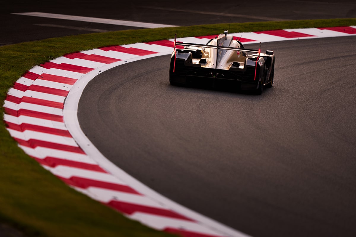 Bird's-eye View of the Cadillac V-Series.R Hypercar Race Car Speeding Down a Race Track