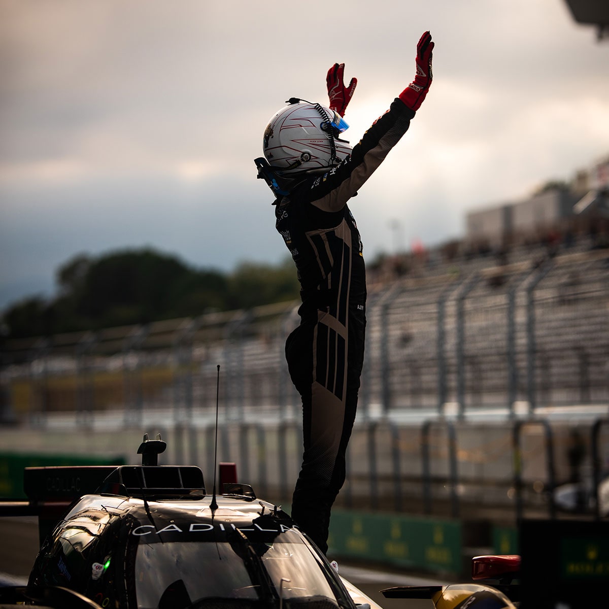 Bird's-eye View of the Cadillac V-Series.R Hypercar Race Car Speeding Down a Race Track