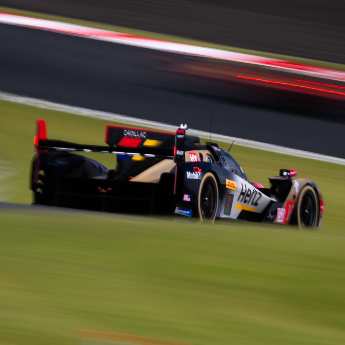 Cadillac Hertz Team JOTA Race Car Driver Wearing Helmet Clenching Fists In Celebration