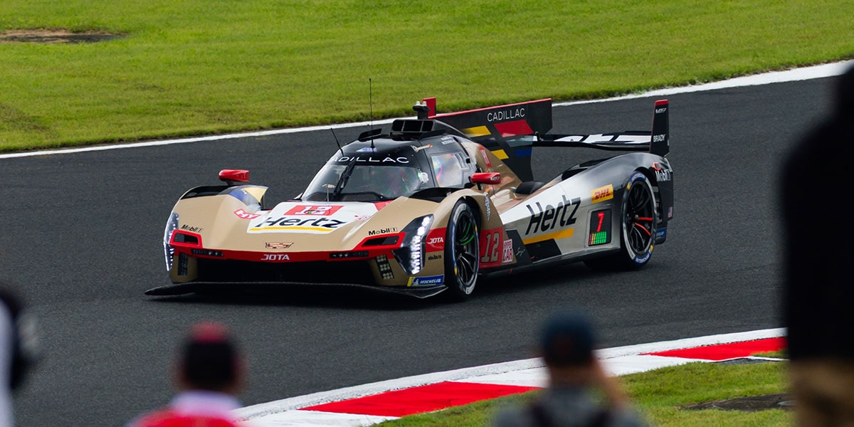 Front View Of Cadillac JOTA Race Car Turning a Corner Down The Track