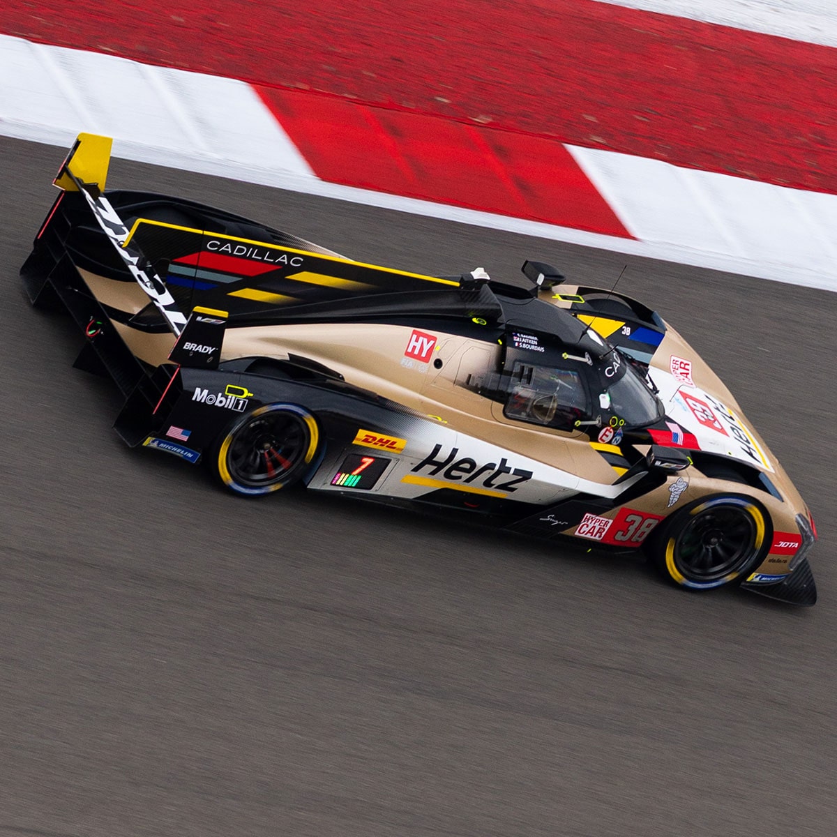 Cadillac Hertz Team JOTA Race Car Driver Wearing Helmet Clenching Fists In Celebration