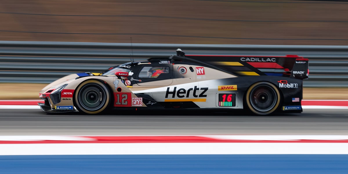 Front View Of Cadillac JOTA Race Car Turning a Corner Down The Track