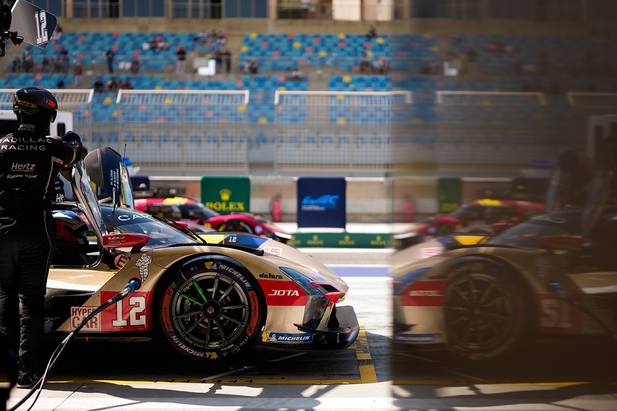 Bird's-eye View of the Cadillac V-Series.R Hypercar Race Car Speeding Down a Race Track