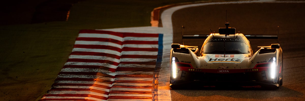 Blurry Rear View Shot of the Cadillac V-Series.R Hypercar Speeding Down the Track