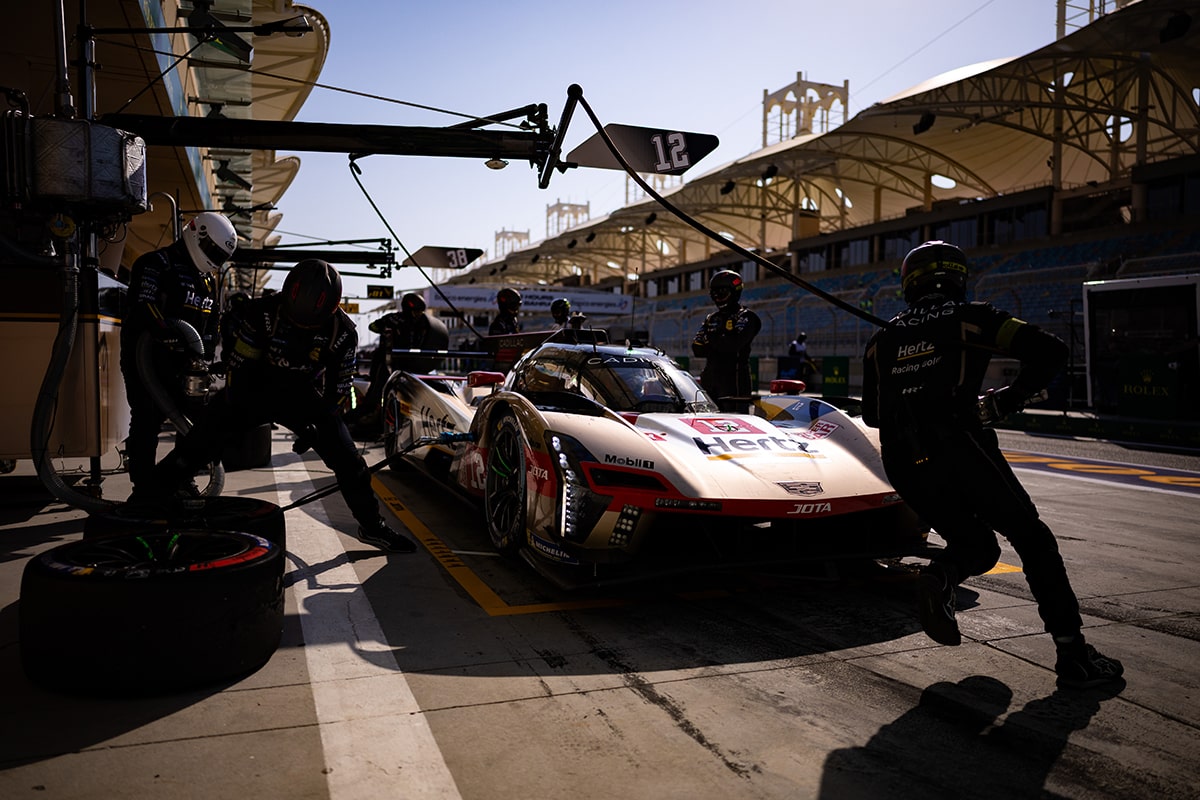 Front View of the Cadillac V-Series.R Hypercar Race Car Driving Down the Curve of a Track