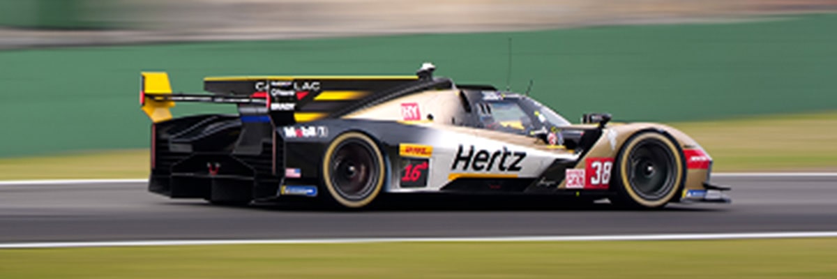Rear Side View of a Cadillac Race Car Driving on the Race Track
