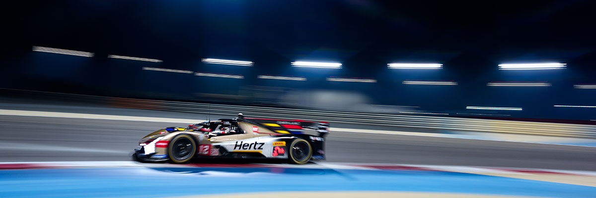 Side View a Cadillac Race Car Speeding Around the Race Track