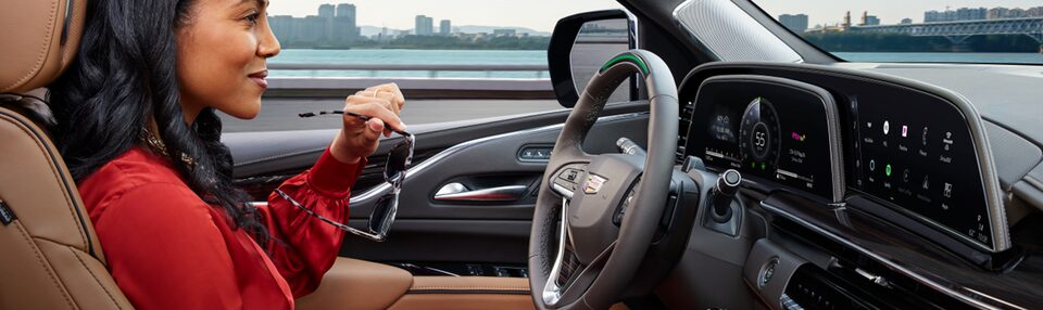 Woman Driving Cadillac Escalade While Earning My Cadillac Rewards