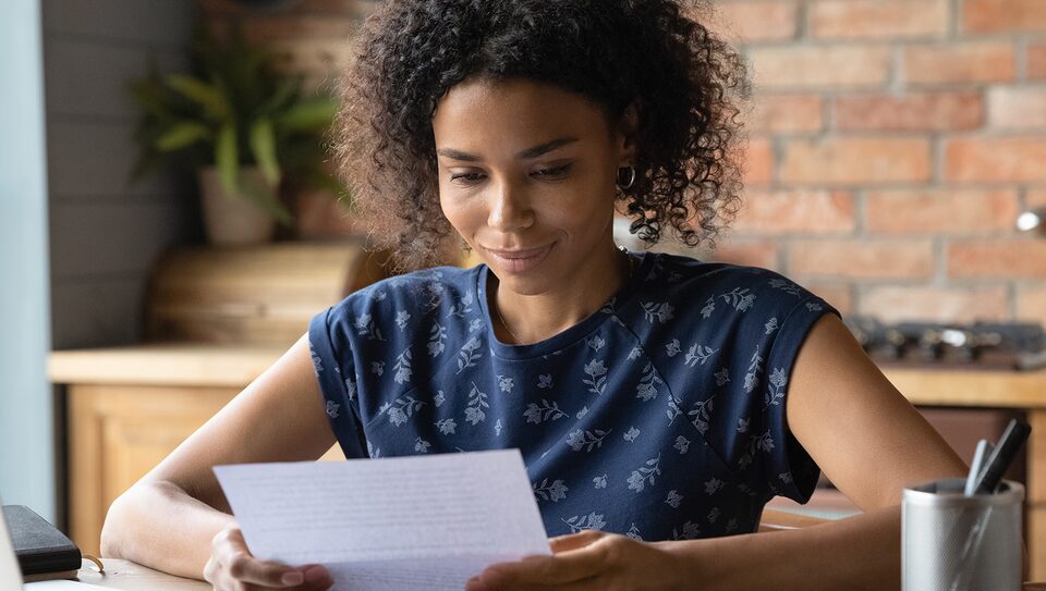 Woman Reviewing Her GM Business Card Statement