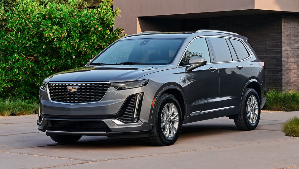 Cadillac Escalade Parked in Front of Family Home in Driveway