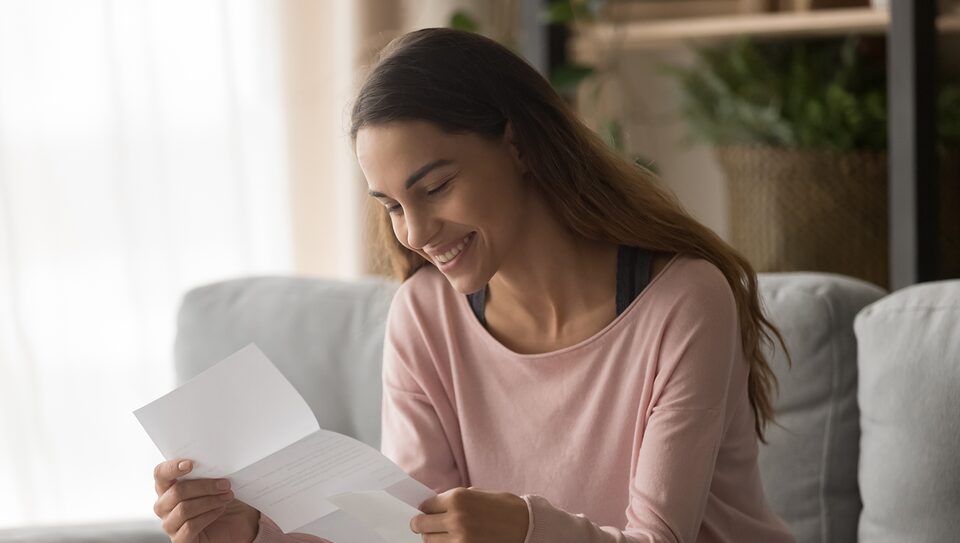 Woman Viewing Her My Cadillac Rewards Extended Family Card Statement