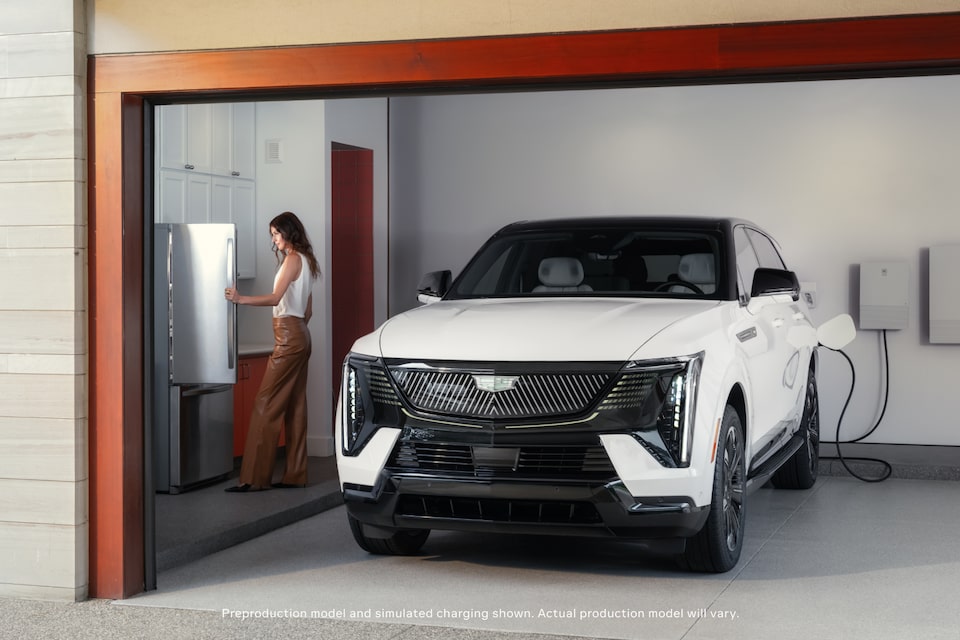 Woman next to charging white car