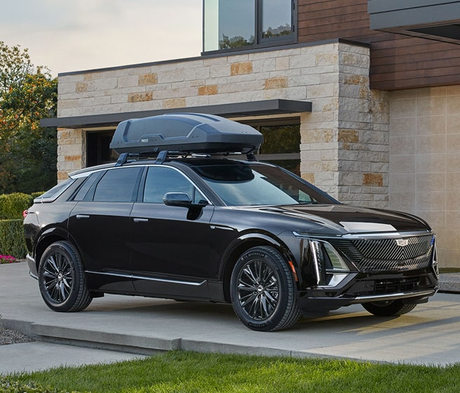 Cadillac vehicle with storage accessory on top 