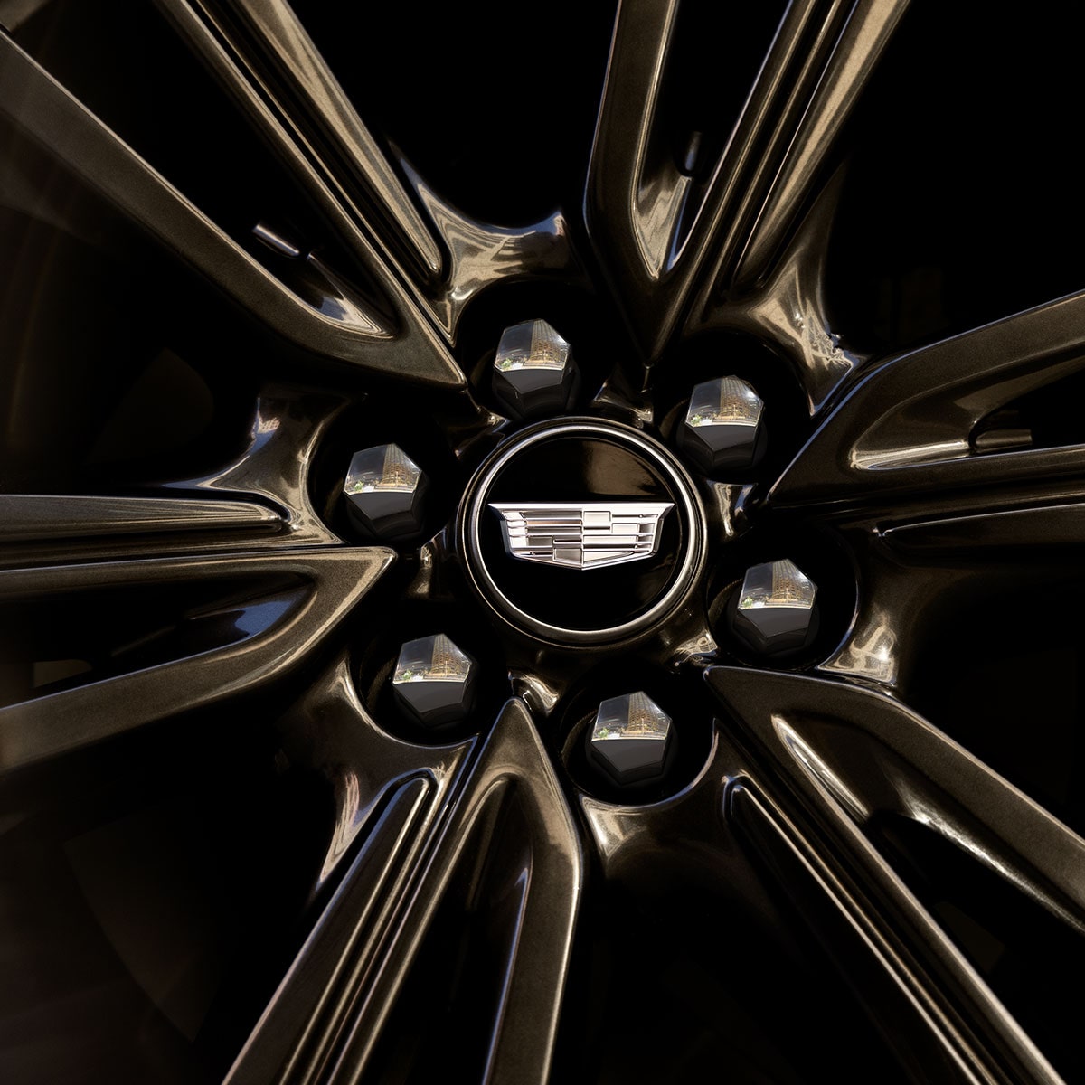 Close-up of the Cadillac Logo on the Middle of a Wheel Rim