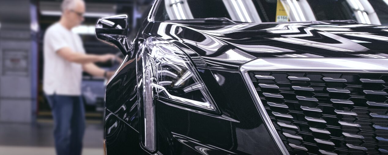 Man reviewing Cadillac XT6 after assembly