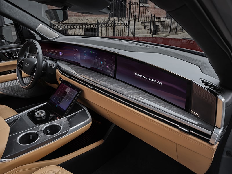 Passenger Side View of the ESCALADE IQ 55" Diagonal Display Screen and Front Row Interior