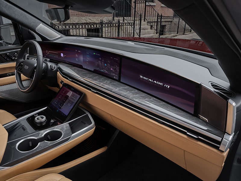 Passenger Side View of the ESCALADE IQ 55" Diagonal Display Screen and Front Row Interior