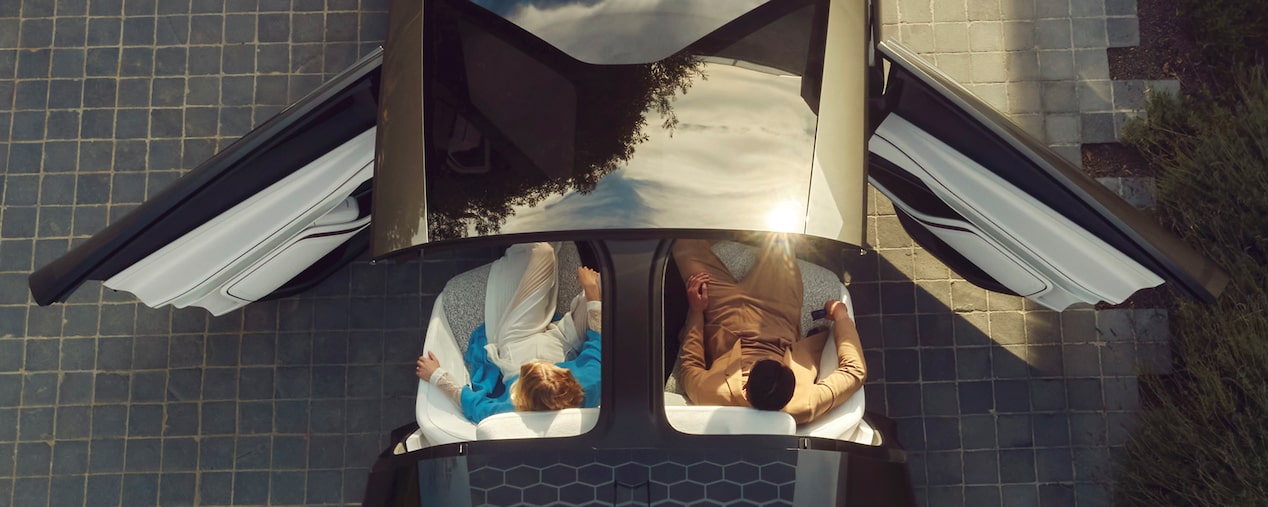 Top View of the Cadillac InnerSpace Concept Vehicle with the Doors and Roof Top Open with People in the Front Seats