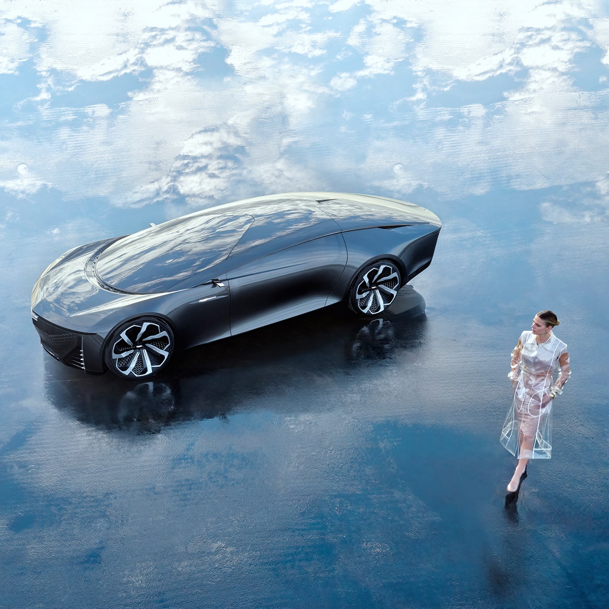 Top View of a Woman Walking near the Cadillac Innerspace Concept Vehicle Parked on a Reflective Ground