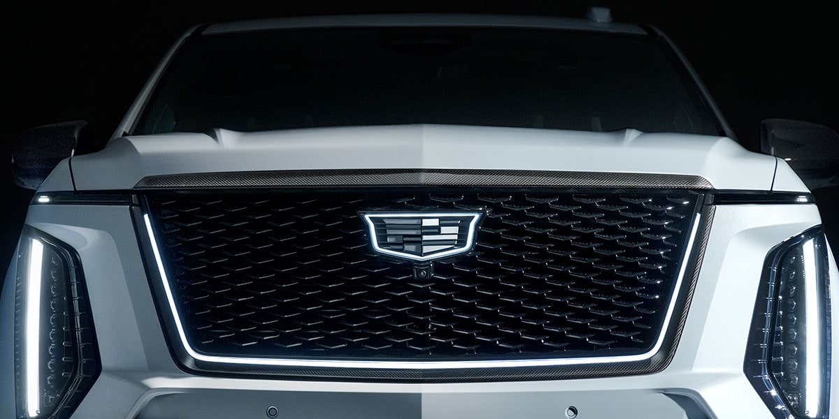 Close-up of the White Cadillac Escalade-V Grille and its Illuminated Cadillac Logo