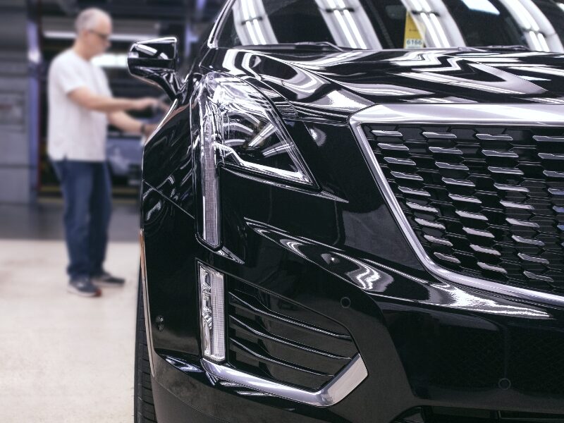 Man reviewing Cadillac XT6 after assembly