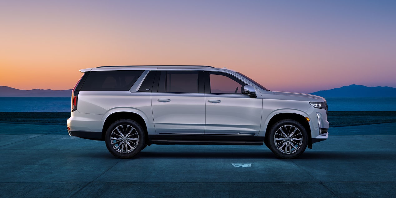 A Side Profile View of the White Cadillac Escalade