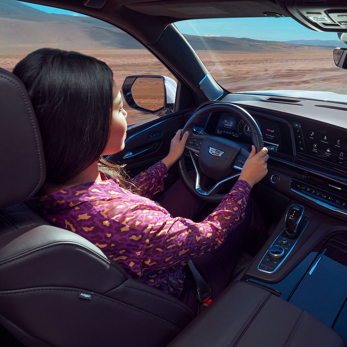 A Women in the Driving Seat of the new Cadillac Escalade
