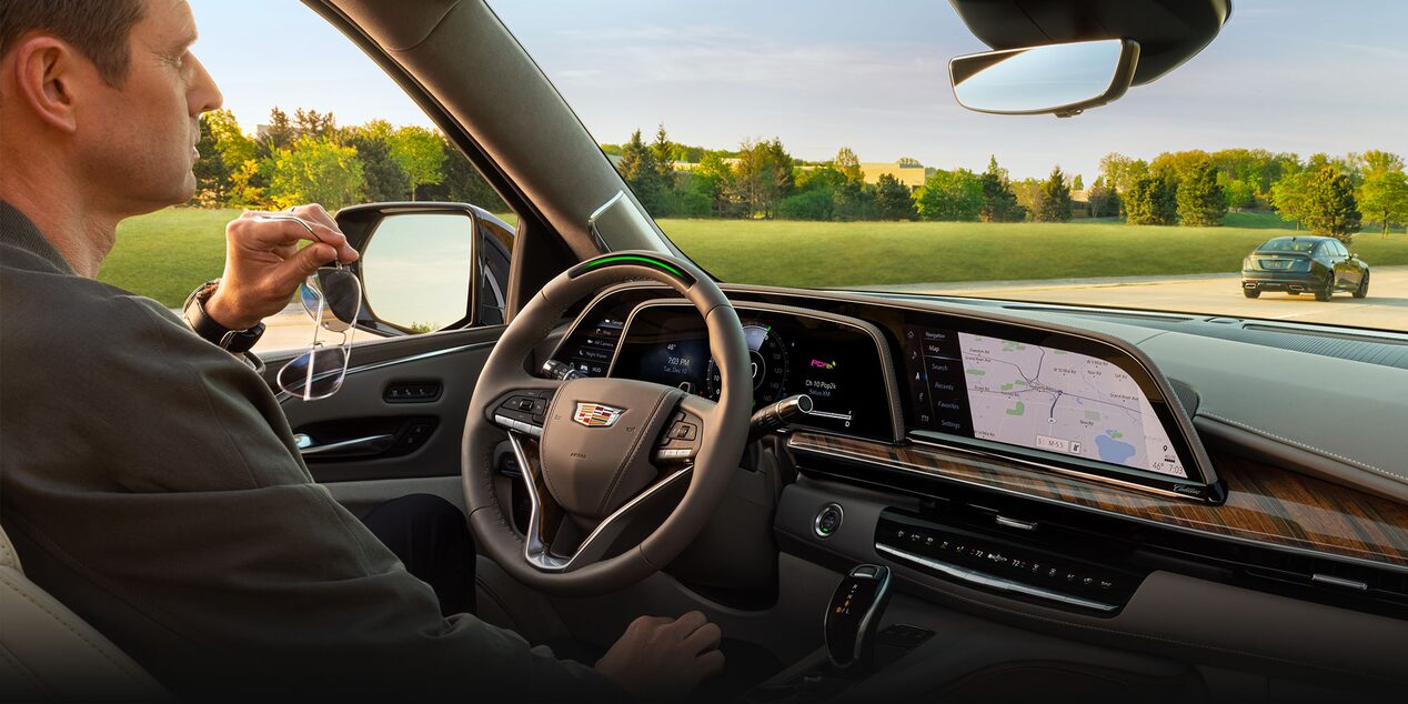 A Man in the Driver's Seat of the Cadillac Escalade