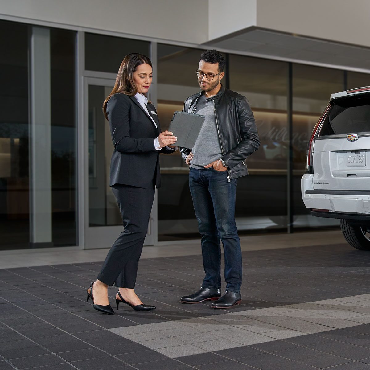 Cadillac Employee Helping Customer with Vehicle Quote