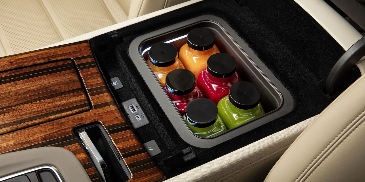 Interior Center Console Hidden Refrigerator Filled with Multiple Drinks