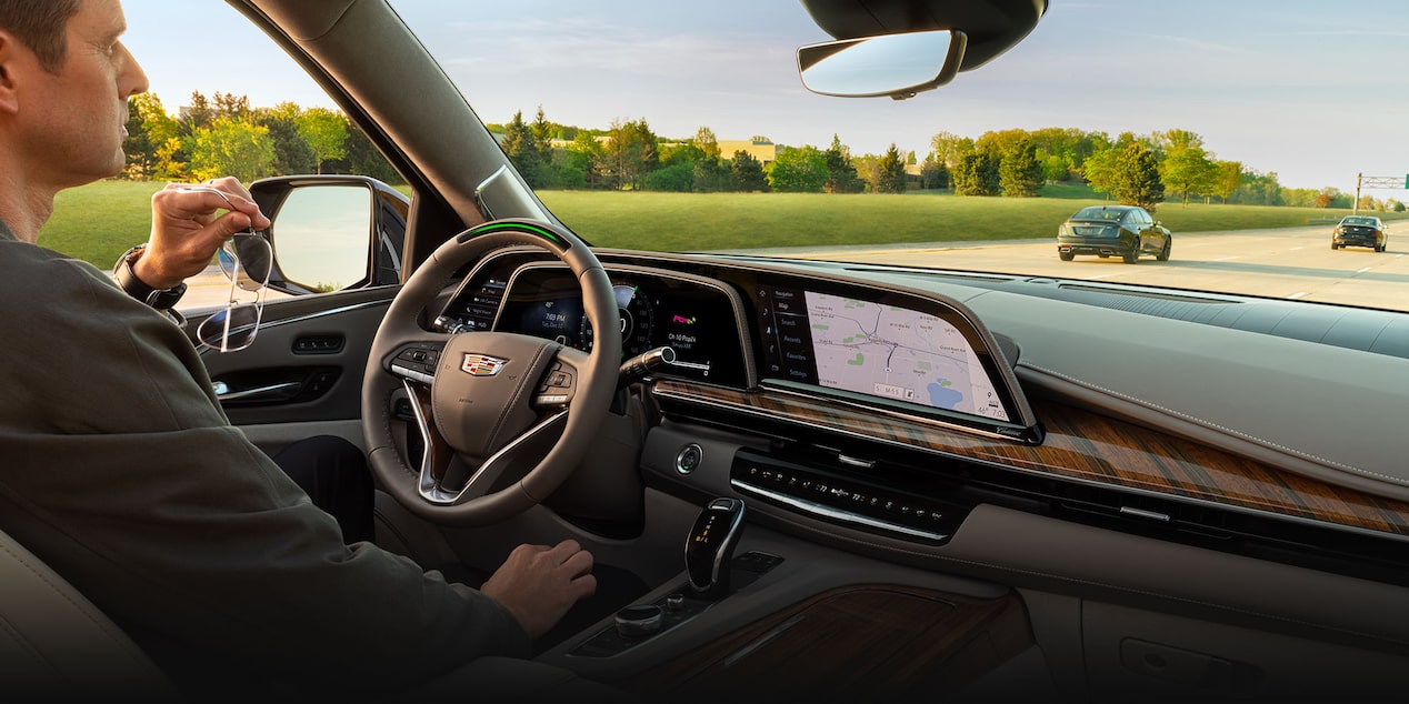 A Man Driving his Cadillac Escalade While Using the Super Cruise Feature