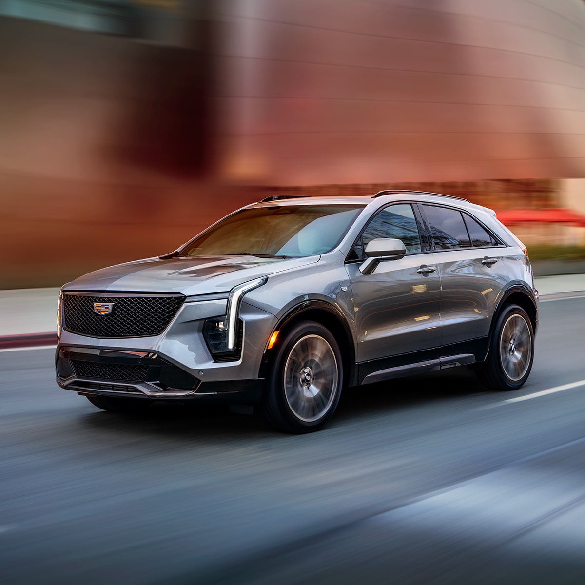The Cadillac XT4 Driving Fast Through Downtown Streets