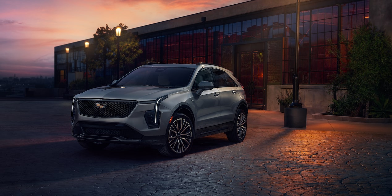 Front view of the 2024 Cadillac XT4 parked in front of a street light