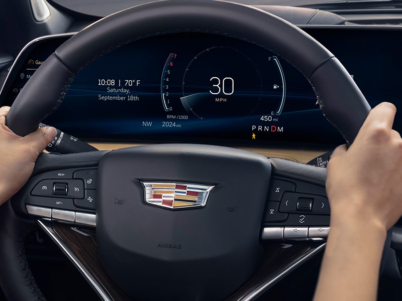 An XT4 Owner Grips the Steering Wheel with Both Hands While Driving