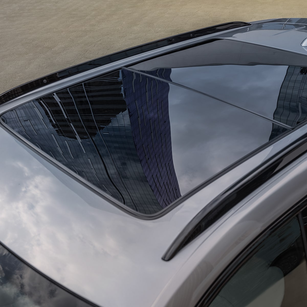 The Massive Sunroof of the XT4 Reflects the Clouds in the Sky