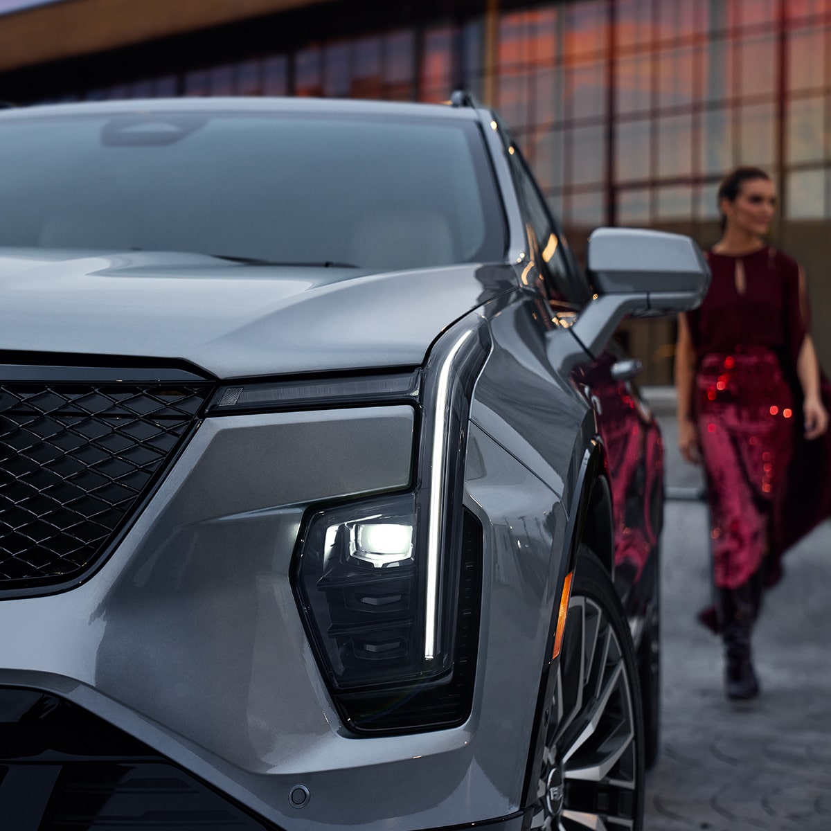 The XT4 Parked on a Rooftop Lot in the City with the Sunset in the Distance