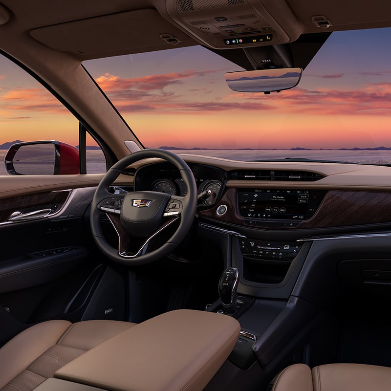 Passenger Perspective of the Cabin Inside the Cadillac XT6 While Admiring the Sunset