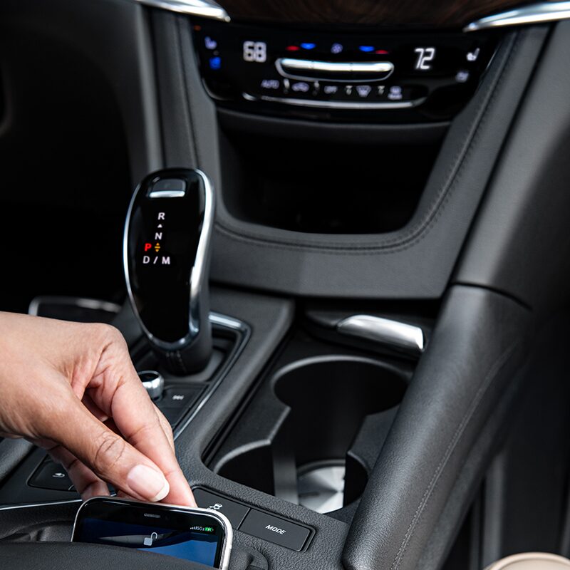 Driver Using the Mobile Device Technology Inside the New Cadillac XT6