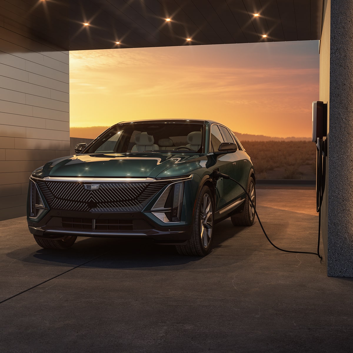 The Cadillac LYRIQ Parked in a Garage while Charging with a Gorgeous Sunset Backdrop