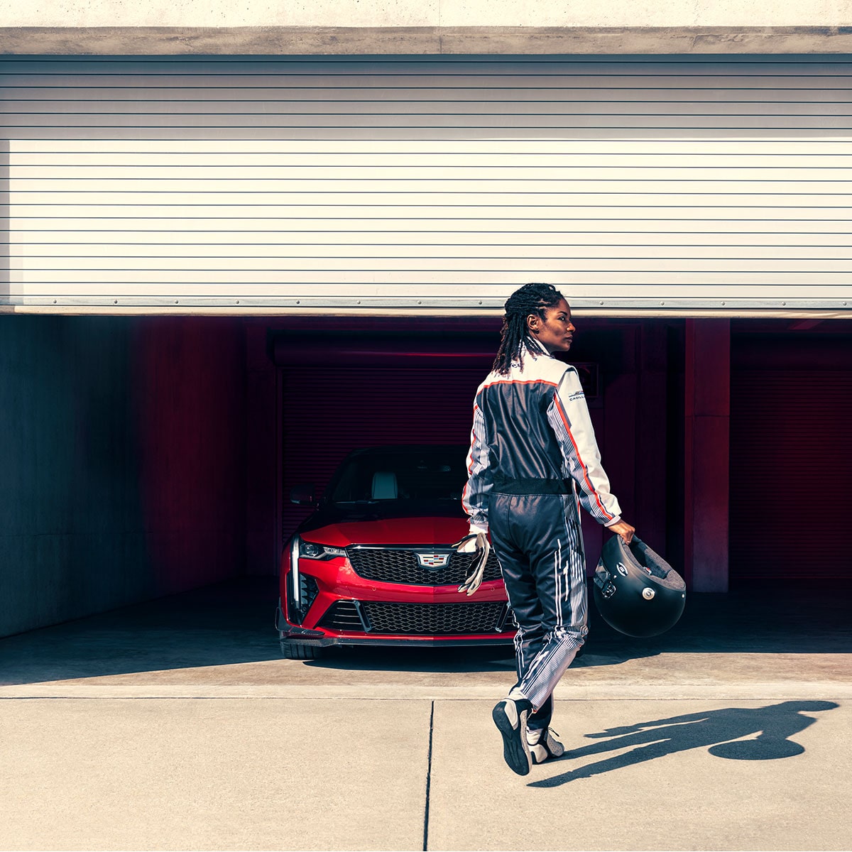 Woman approaching a CT4-V at the Track