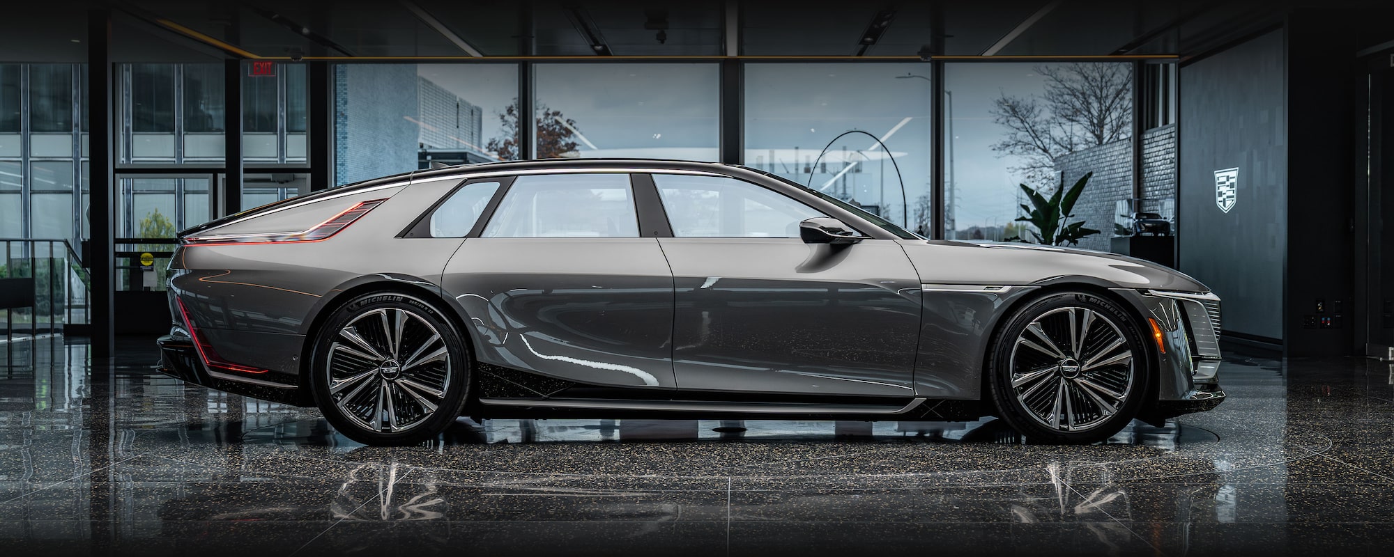 The Gray Cadillac CELESTIQ Car is Parked with its Distinctive Grille and Headlights Facing Forward.